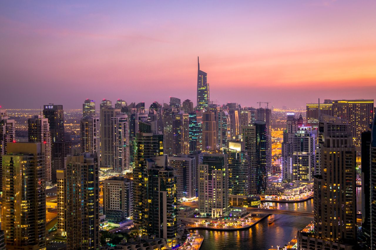modern Dubai skyline with business district skyscrapers at sunset showing commercial trade hub architecture